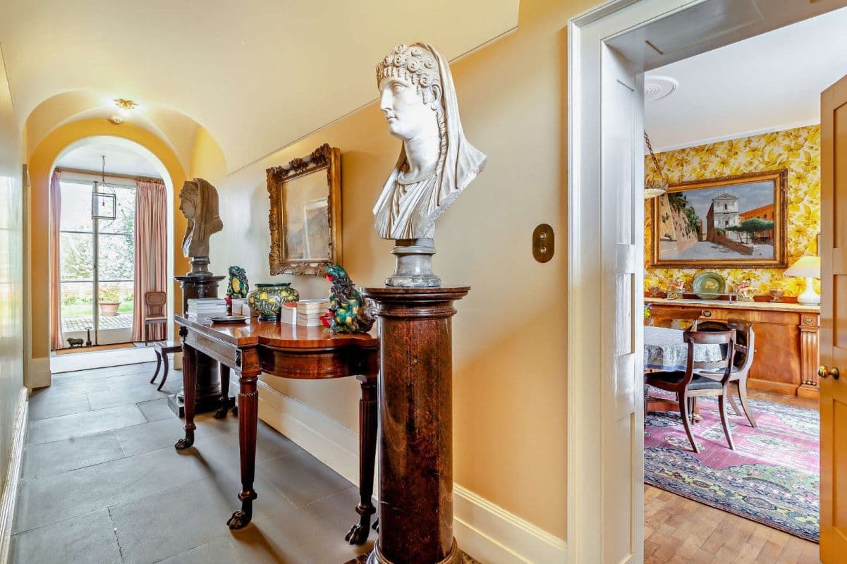 The Centre Hall, Great House, where lots 272 and 280 are visible. For more information on the busts, please see page 207. Image courtesy of Strutt & Parker.